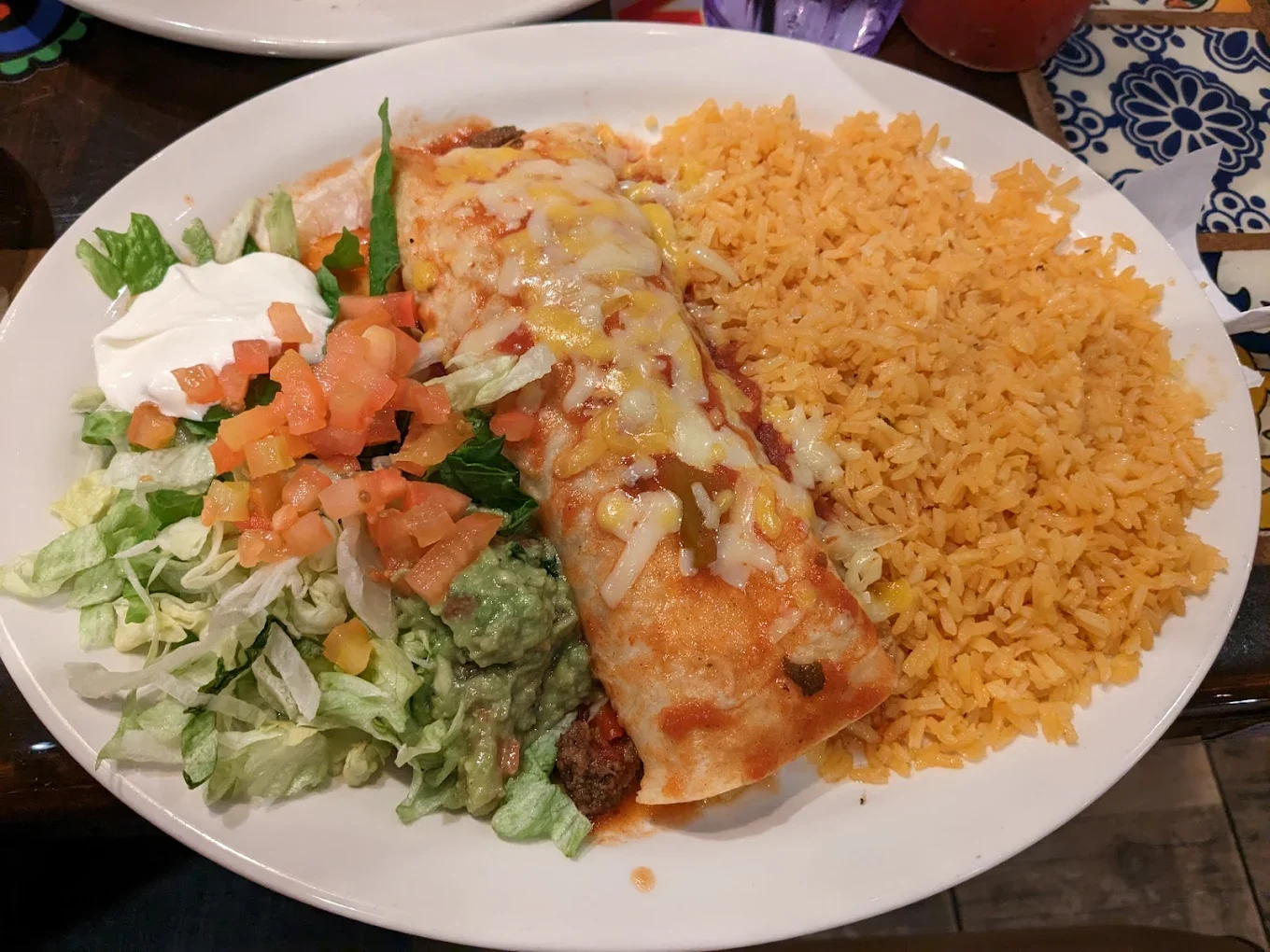 Burrito Supreme - Overstuffed burrito with your choice of meat and all the toppings