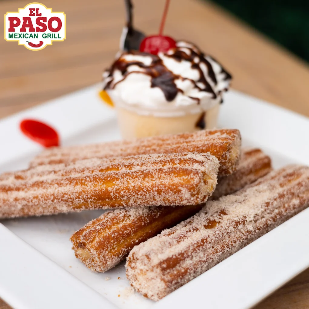 Churros - Crispy cinnamon-sugar churros served with chocolate dipping sauce