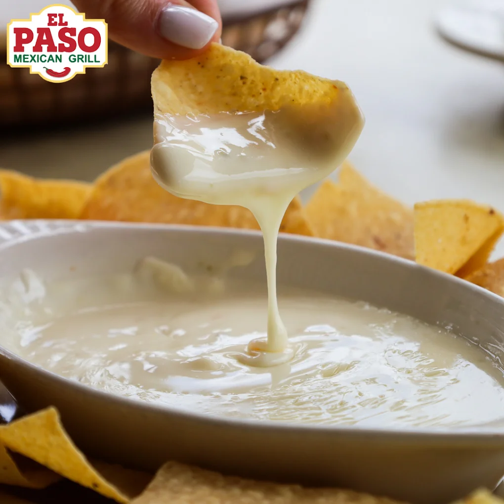 Queso Dip - Warm, creamy queso dip served with fresh tortilla chips