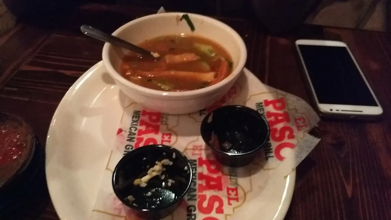 Tortilla Soup - Rich tomato-based soup with crispy tortilla strips, cheese and avocado